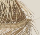 Suspension tressée en fibre de palmier avec franges en paille – Un charme naturel et bohème